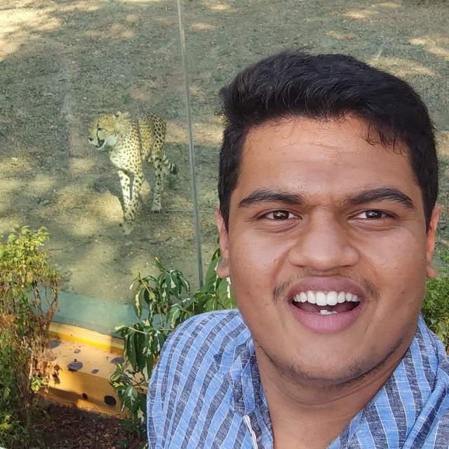 Me in Mysore zoo in front of cheetah posing for a selfie